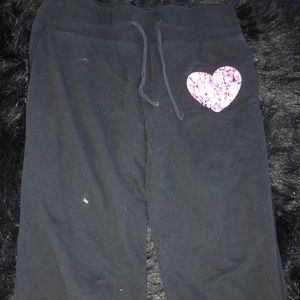 Black sweatpants with pink heart